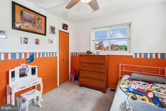 carpeted bedroom with ceiling fan