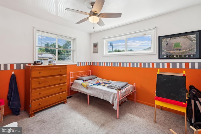 bedroom with carpet flooring and a ceiling fan