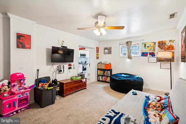 game room with carpet, visible vents, and crown molding