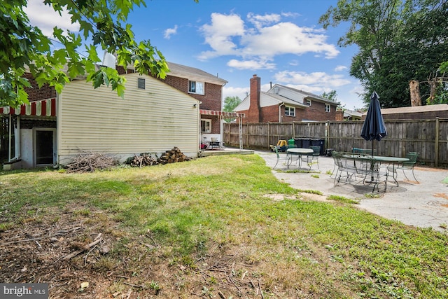 view of yard with a patio area and fence