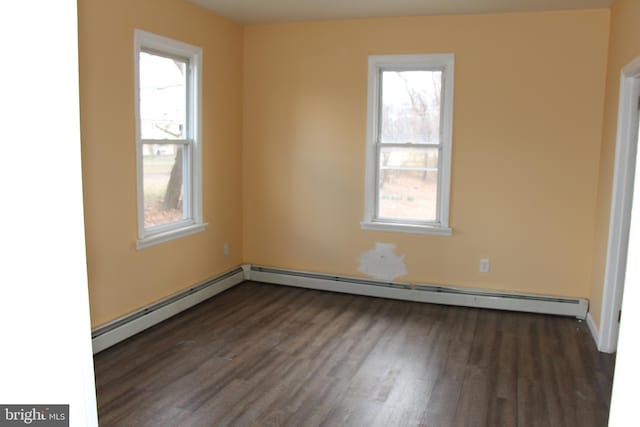 empty room with plenty of natural light and dark hardwood / wood-style flooring