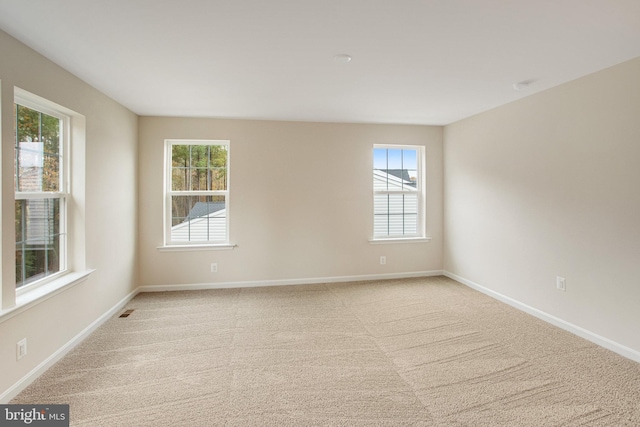 empty room featuring light colored carpet