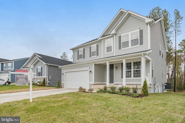 view of front of house with central AC, a front lawn, covered porch, and a garage