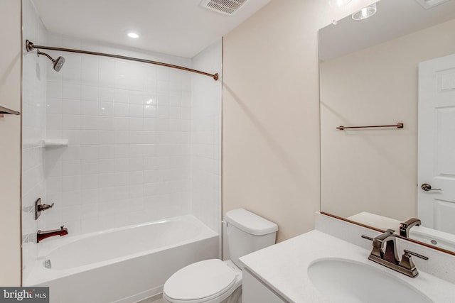 full bathroom with vanity, toilet, and tiled shower / bath