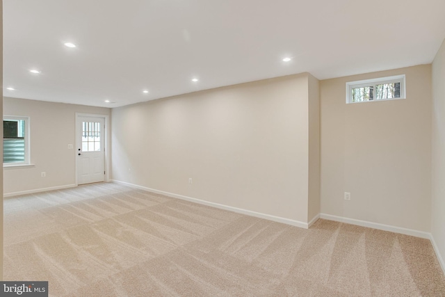 basement with light colored carpet