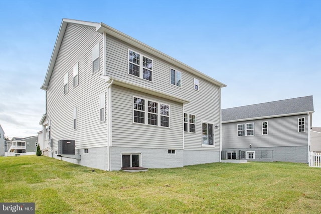 back of house featuring a yard