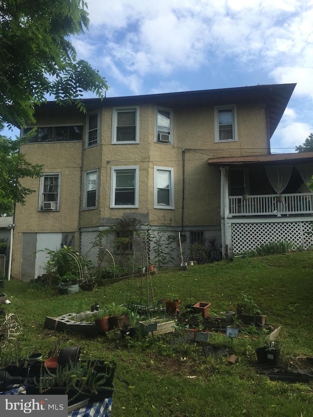 view of side of property featuring a porch