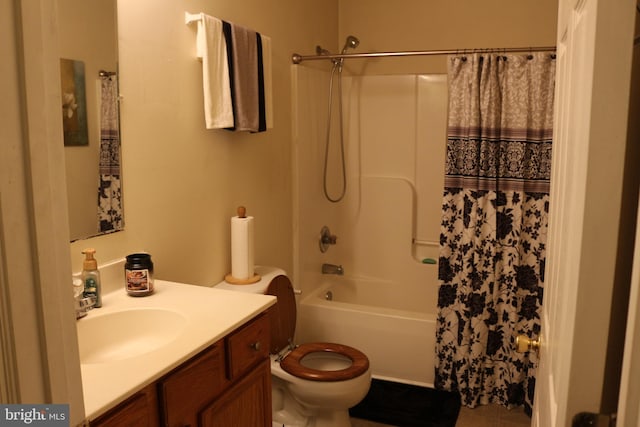 full bathroom featuring tile patterned floors, shower / tub combo with curtain, vanity, and toilet