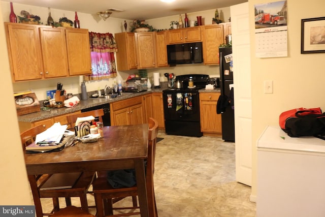 kitchen with sink and black appliances