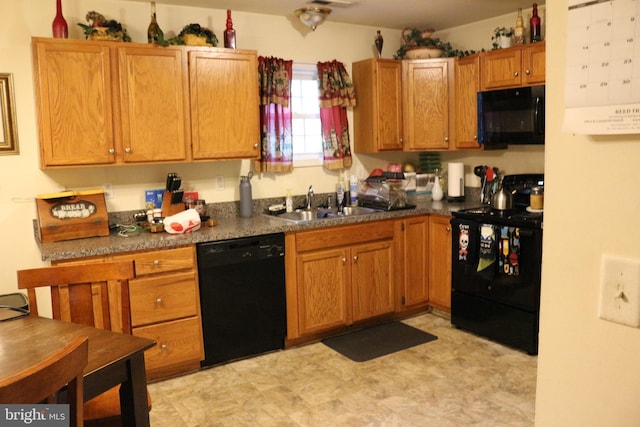 kitchen featuring black appliances and sink