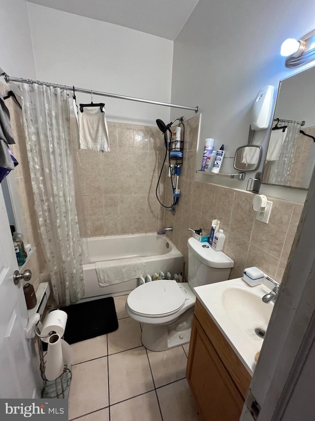 full bathroom with toilet, shower / bath combo with shower curtain, vanity, and tile patterned flooring