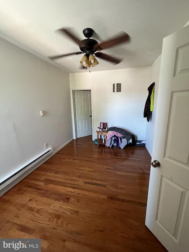 interior space with dark hardwood / wood-style flooring and a baseboard radiator