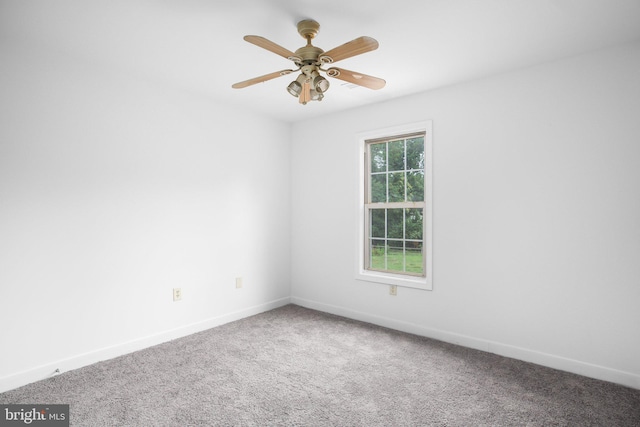 spare room with ceiling fan and carpet floors