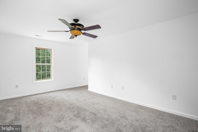 carpeted empty room with ceiling fan