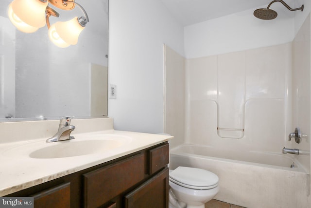 full bathroom with toilet, vanity, and tub / shower combination