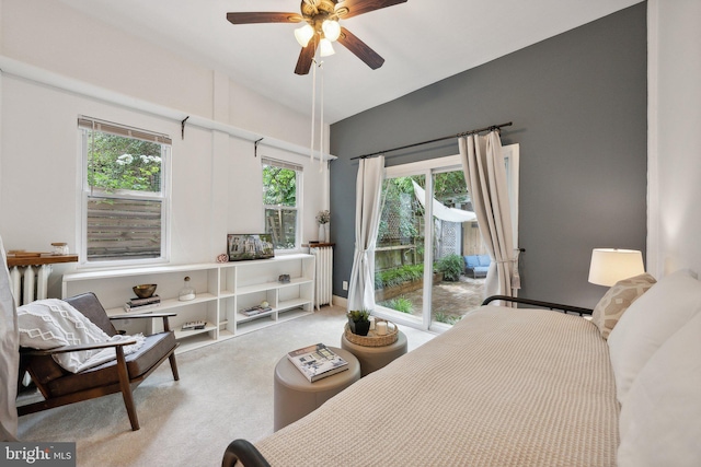 bedroom with ceiling fan, light carpet, and access to outside