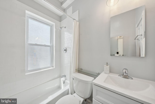 full bathroom featuring vanity, toilet, plenty of natural light, and shower / tub combo