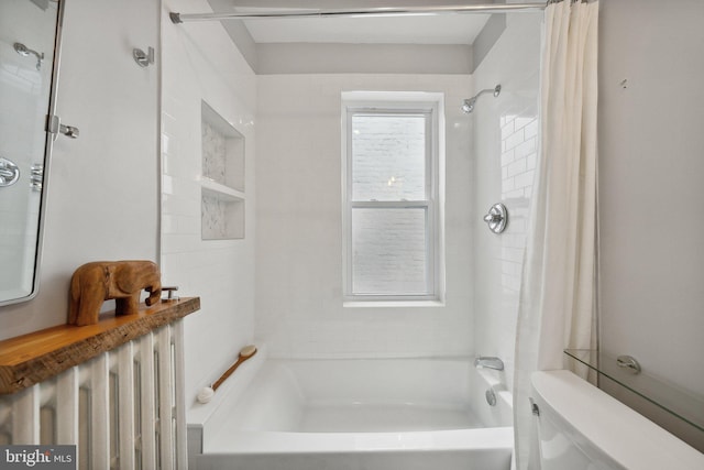 bathroom with toilet, radiator, and shower / tub combo with curtain