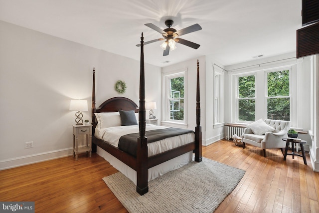 bedroom featuring wood-type flooring and ceiling fan