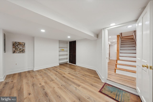 basement featuring light hardwood / wood-style floors