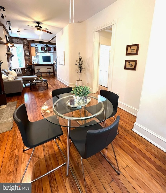 dining room featuring ceiling fan and wood-type flooring