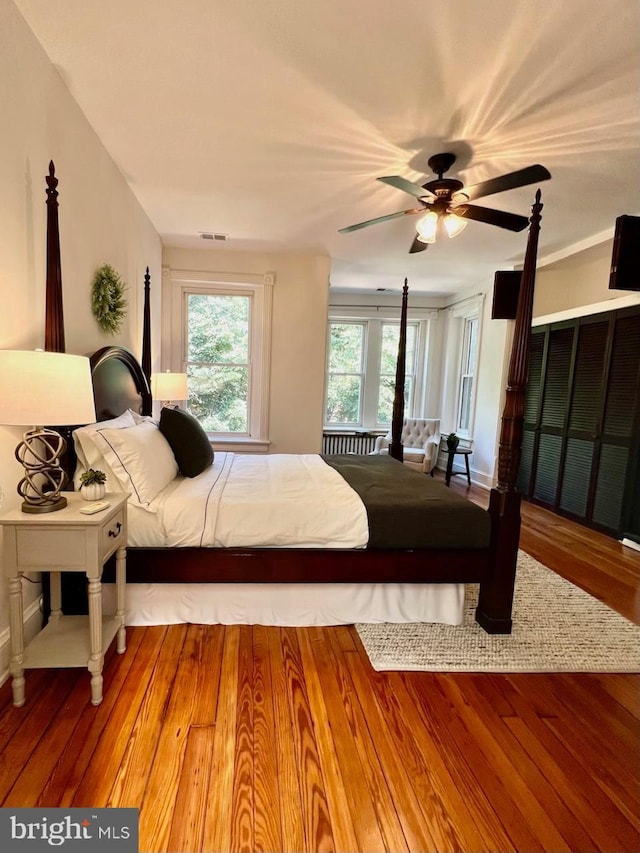 bedroom featuring ceiling fan and hardwood / wood-style floors