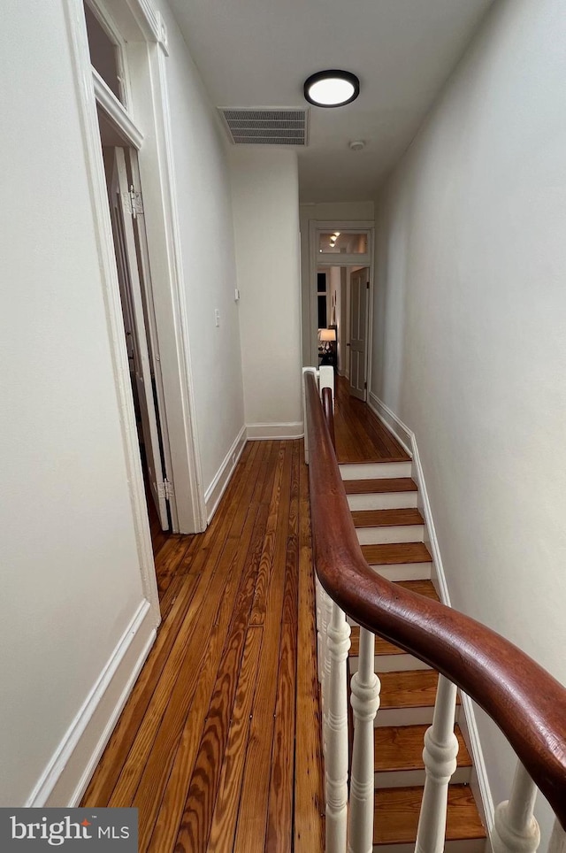 hall with dark hardwood / wood-style flooring