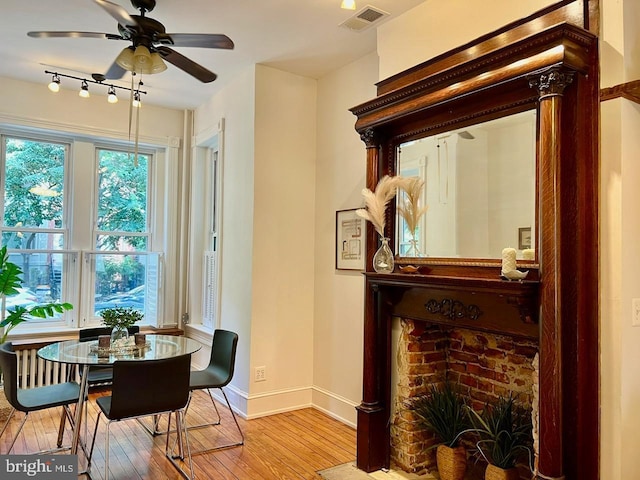 dining area featuring ceiling fan and light hardwood / wood-style floors