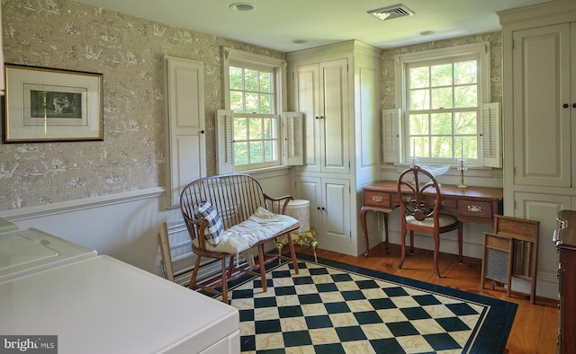 living area featuring dark hardwood / wood-style floors and washer and dryer