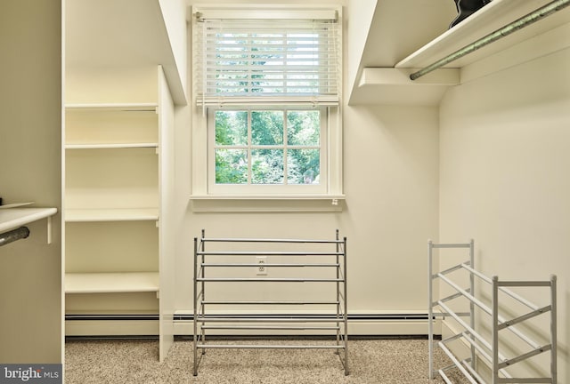 walk in closet featuring baseboard heating