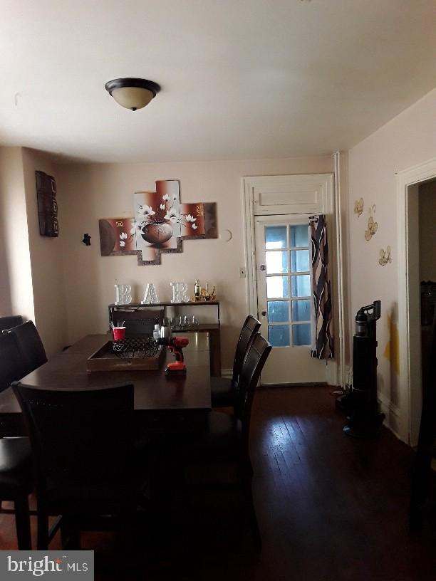 dining space featuring dark hardwood / wood-style flooring