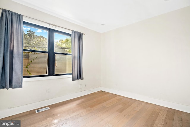 empty room featuring hardwood / wood-style floors