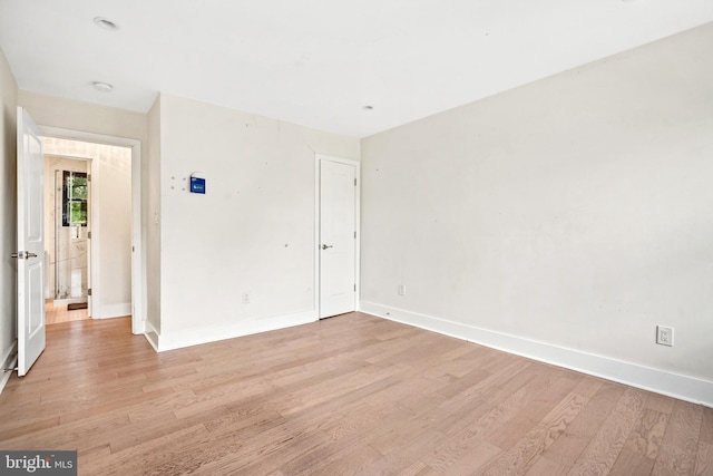 spare room with light wood-type flooring