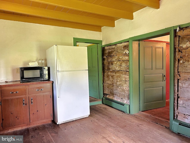 kitchen featuring beamed ceiling, white fridge, light wood-type flooring, and a baseboard heating unit