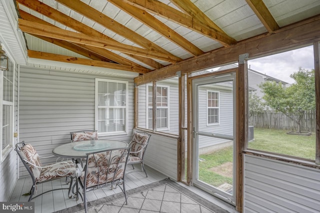 sunroom with vaulted ceiling with beams and wooden ceiling