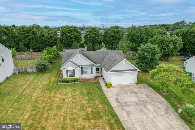 single story home with a front yard and a garage