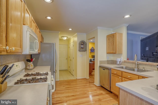 kitchen featuring white appliances, crown molding, sink, tasteful backsplash, and light hardwood / wood-style floors