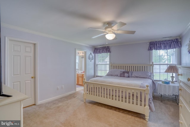 carpeted bedroom featuring ceiling fan, ornamental molding, and ensuite bathroom