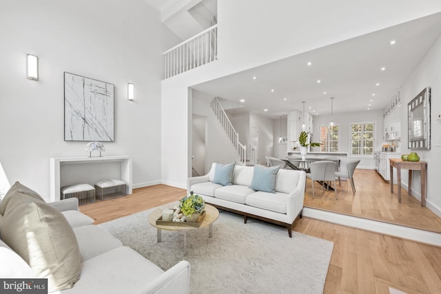 3604 Winfield Ln NW, Washington, DC 20007 - living area with stairs, light wood-style floors, and recessed lighting