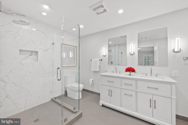 bathroom with tile patterned flooring, toilet, an enclosed shower, and vanity