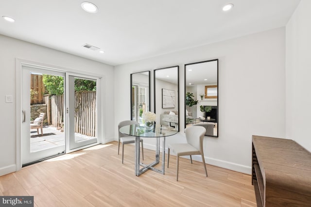 dining space featuring light wood-type flooring