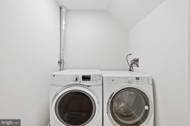 clothes washing area featuring independent washer and dryer