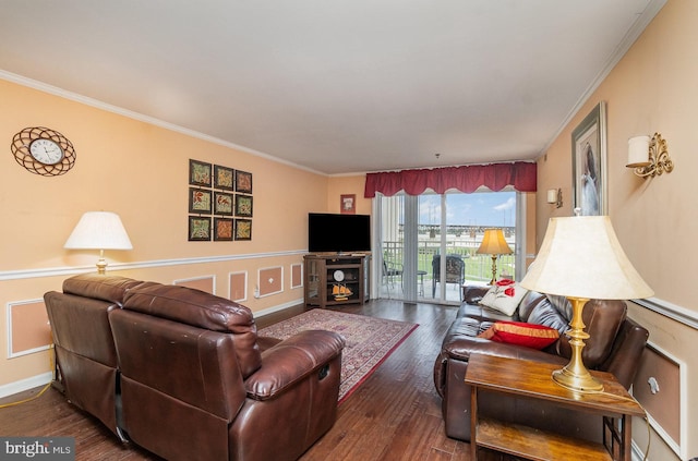 living room featuring dark hardwood / wood-style floors and crown molding