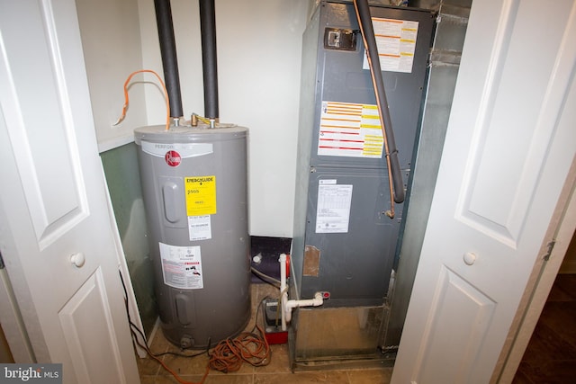 utility room with heating unit and water heater