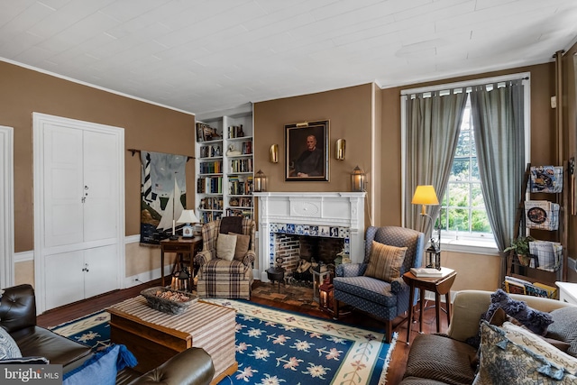 living room with hardwood / wood-style floors and built in features