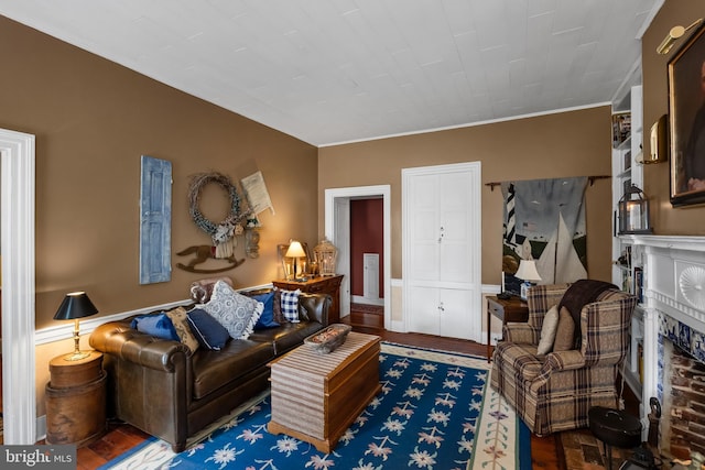 living room featuring wood-type flooring and ornamental molding