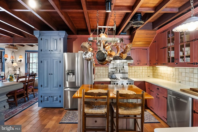 kitchen featuring wooden ceiling, decorative backsplash, beamed ceiling, wood-type flooring, and stainless steel appliances