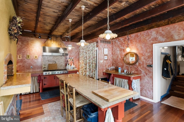 interior space with pendant lighting, wooden ceiling, range hood, beam ceiling, and dark hardwood / wood-style flooring