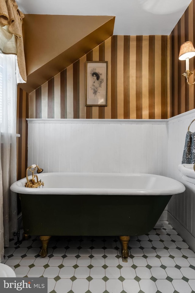 bathroom with a tub to relax in