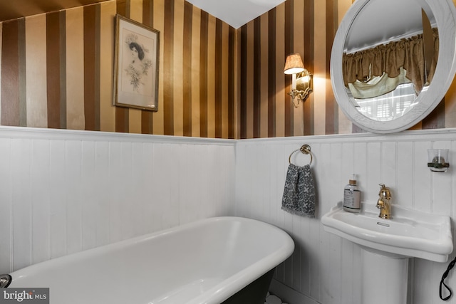 bathroom with a tub and sink